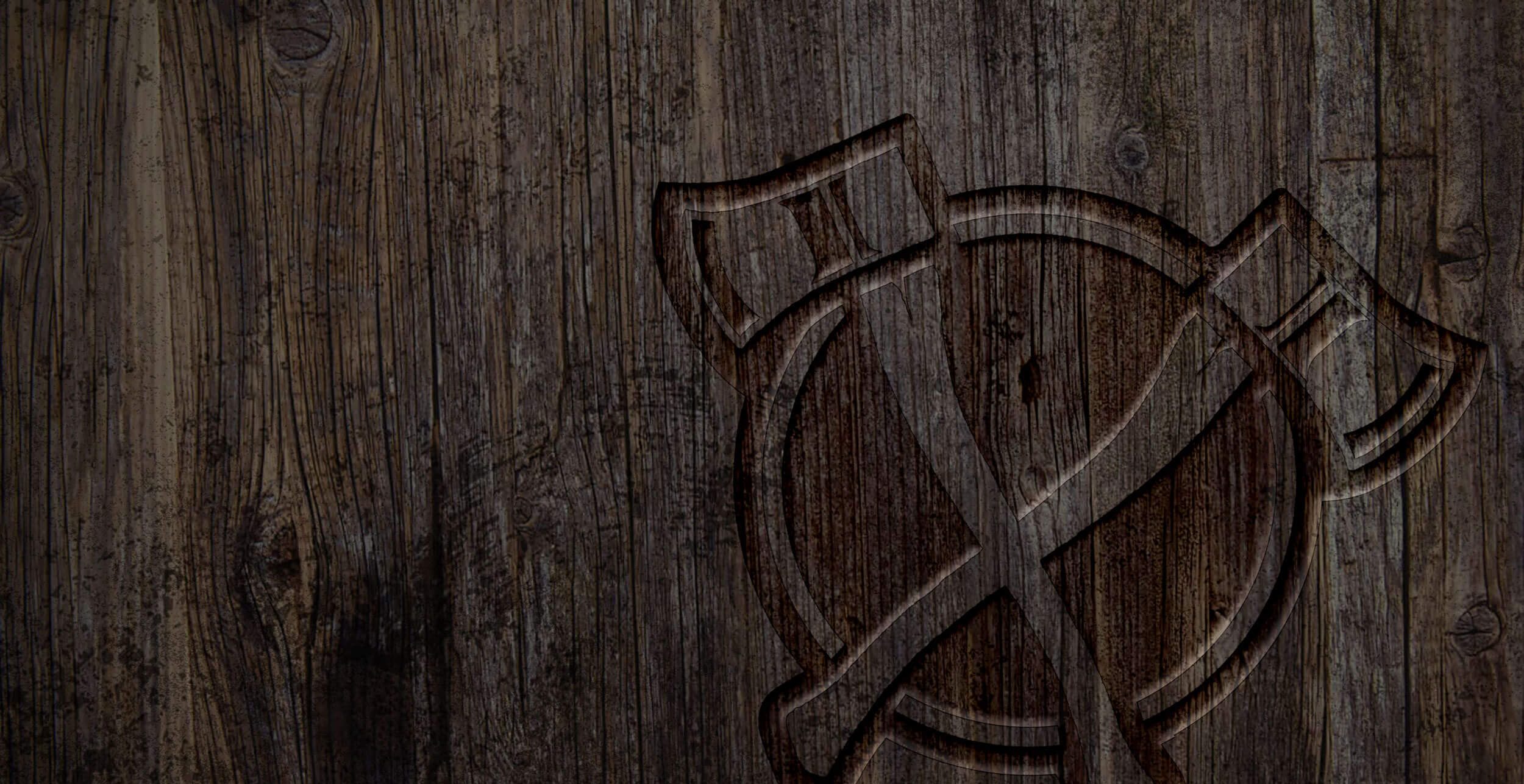 Hero image of Deep South Axe Throwing logo burned into wood